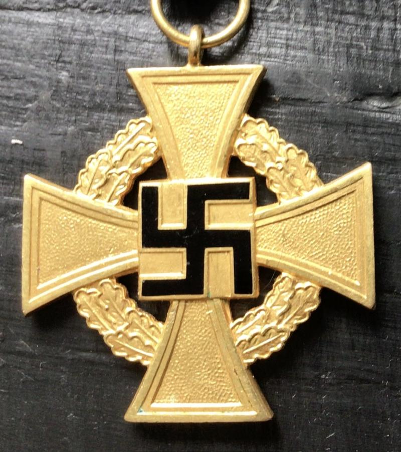 THREE GBP´S AND A GOLD LONG SERVICE MEDAL.