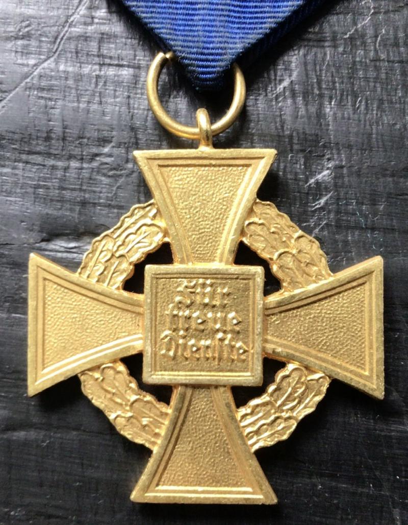THREE GBP´S AND A GOLD LONG SERVICE MEDAL.